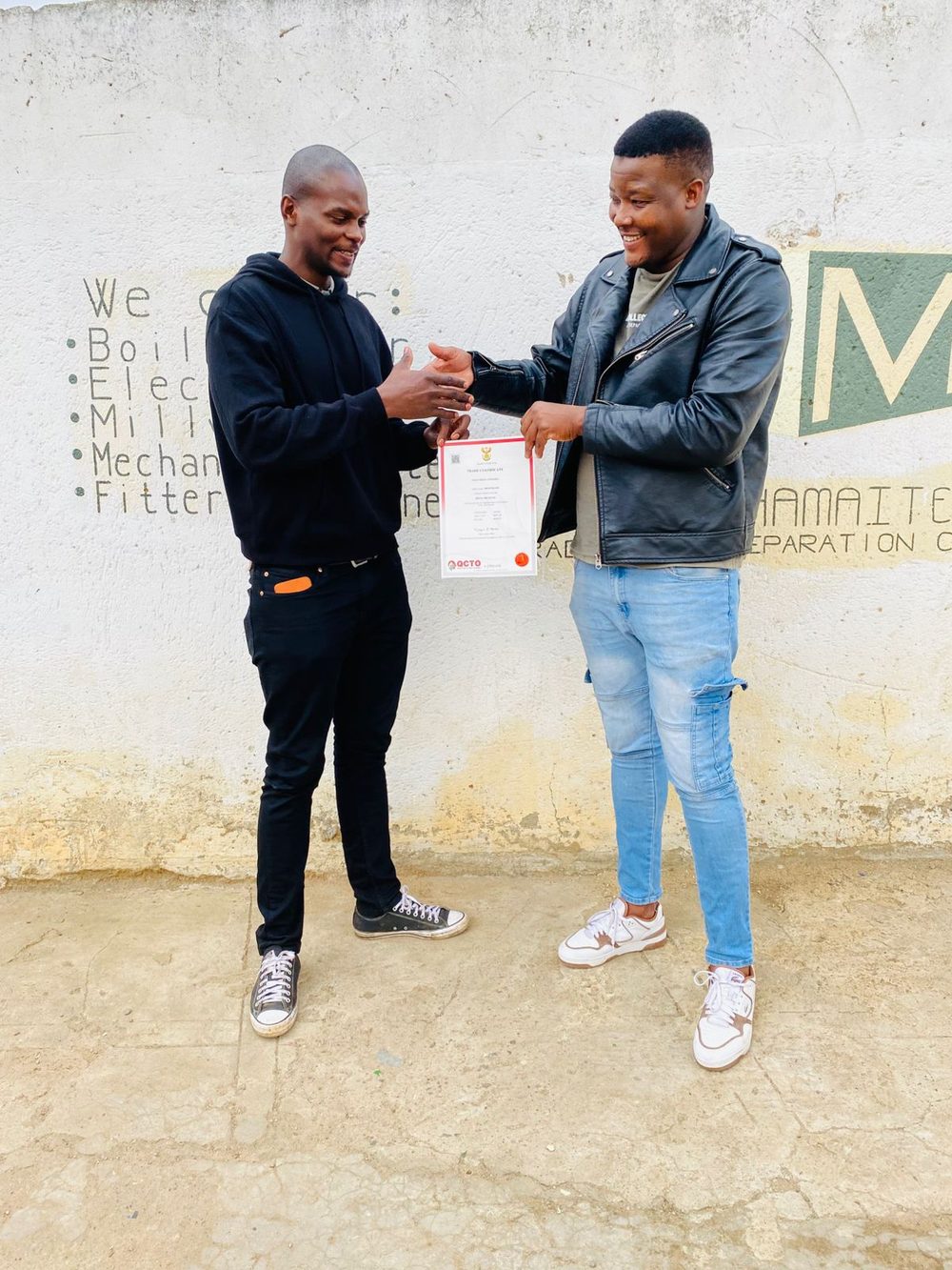 A successful candidate being congratulated
